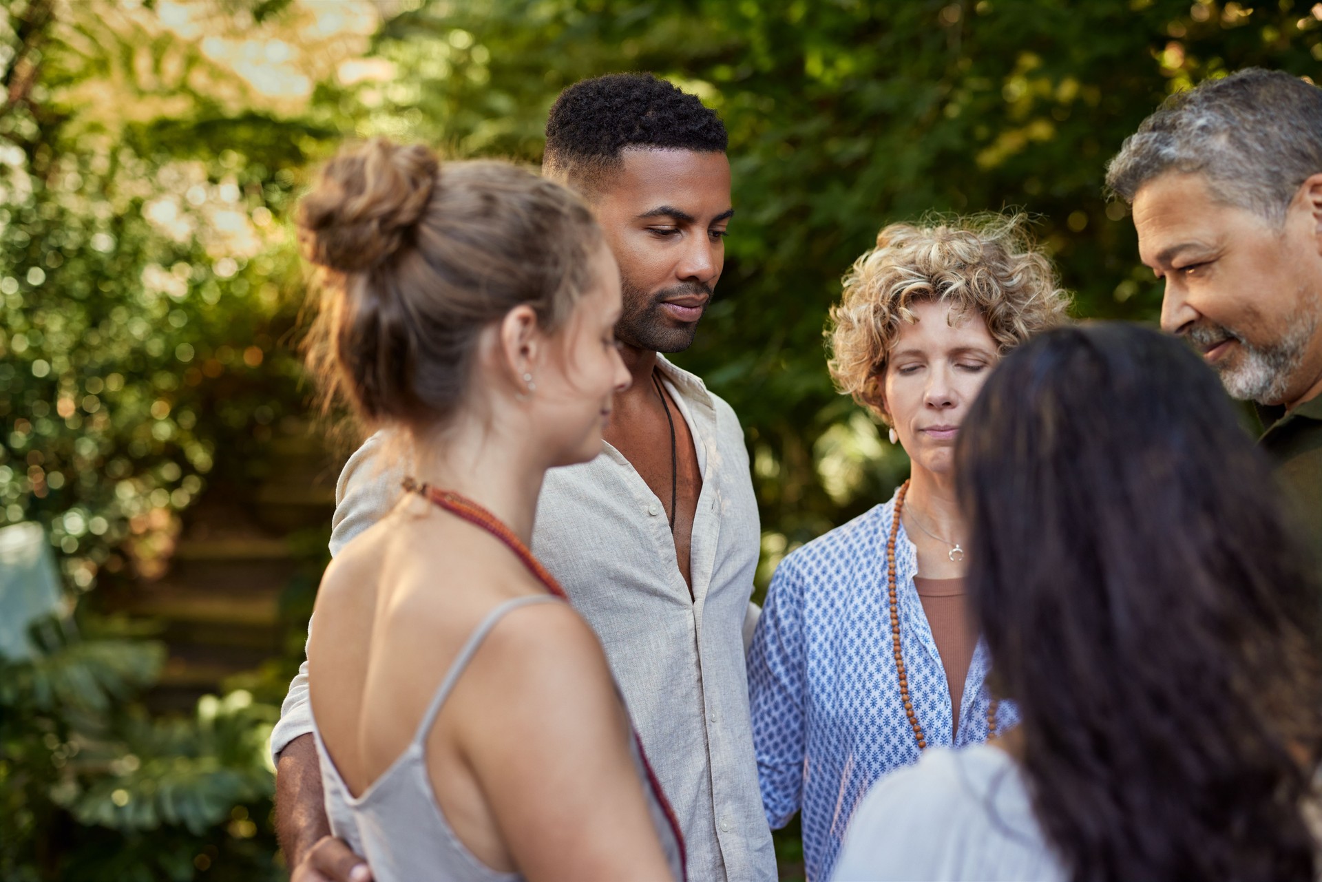 Support group standing in circle with gratitude